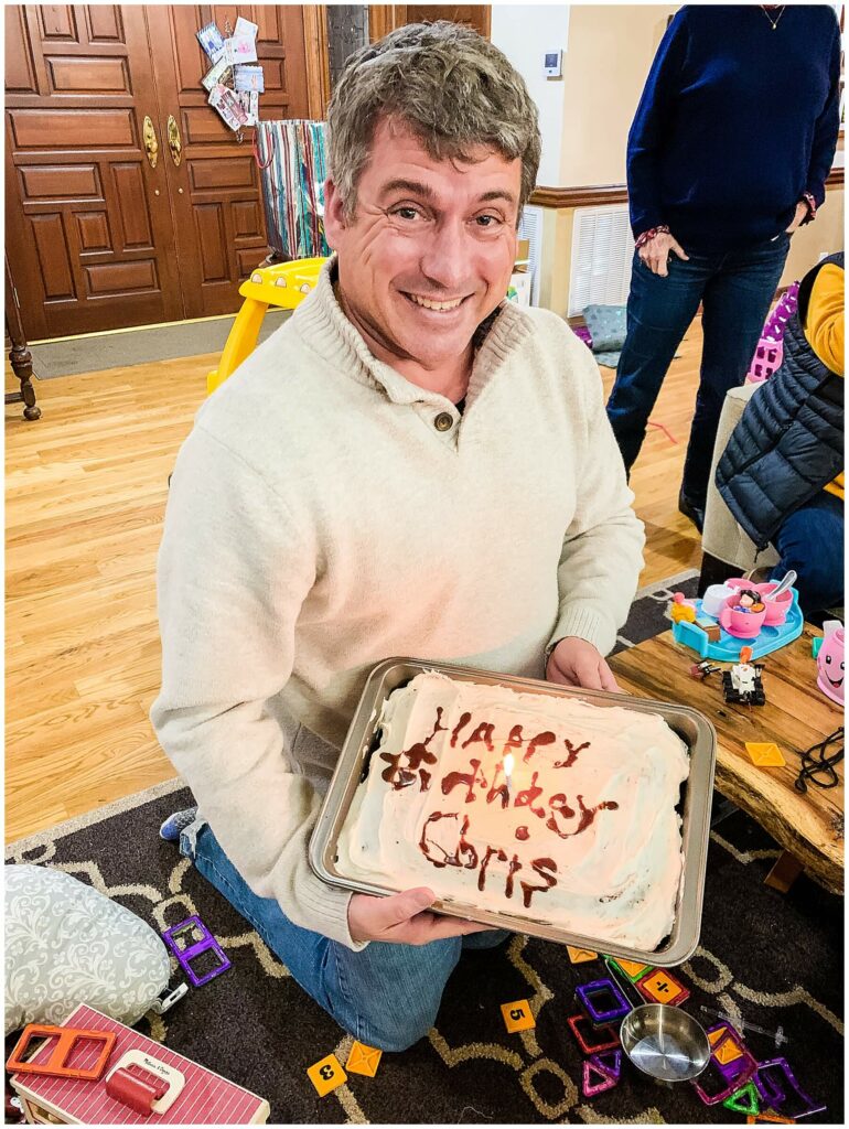 man holding birthday cake