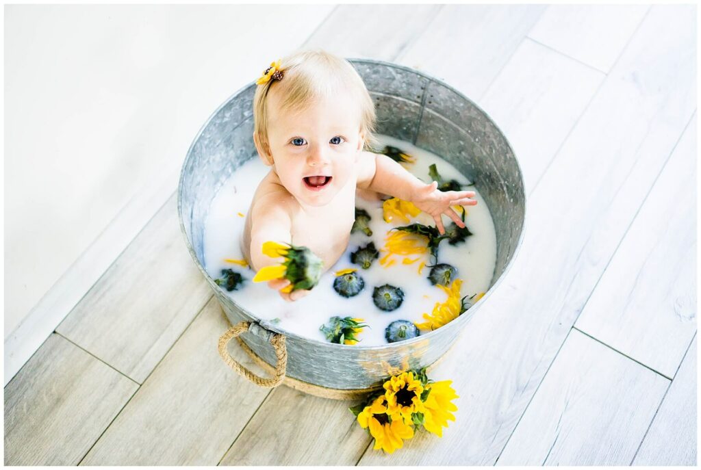 baby in sunflower milk bath