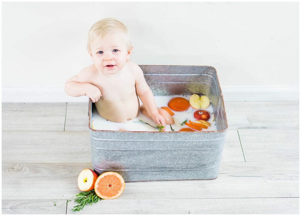 baby in apple and orange milk bath
