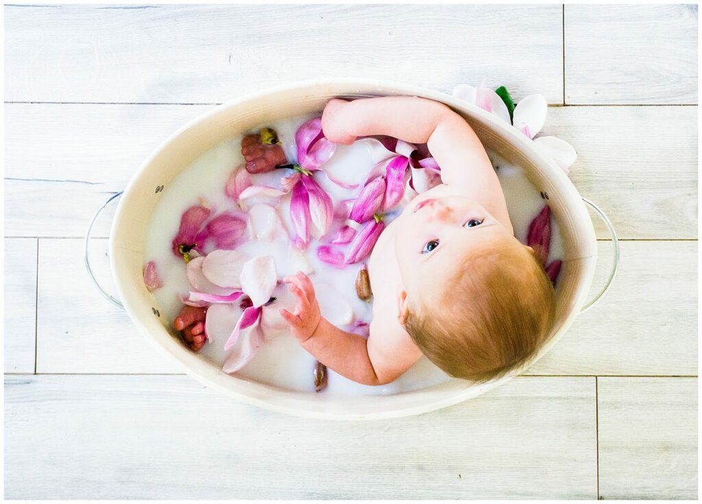 baby in tulip tree flower milk bath