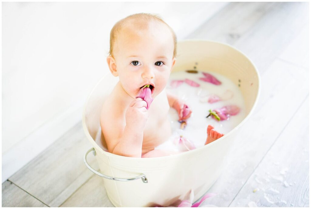 baby in tulip tree flower milk bath