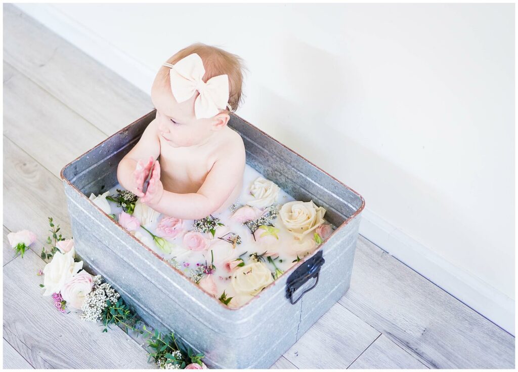 baby in a bridal bouquet milk bath