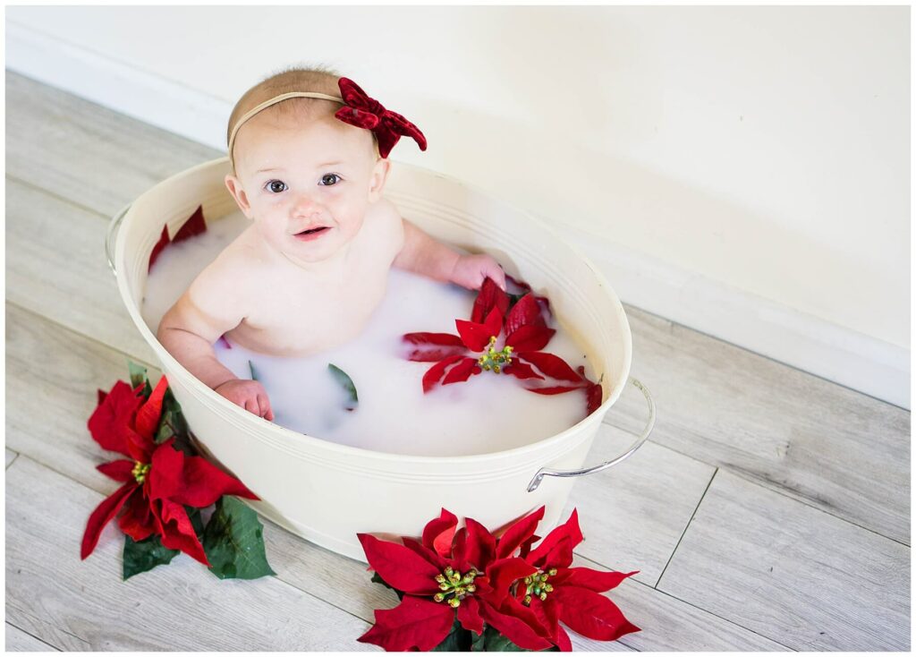 baby in poinsettia milk bath