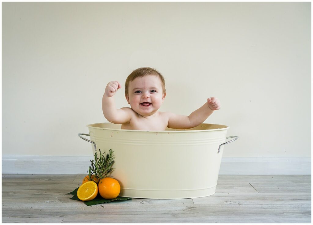 baby in orange milk bath