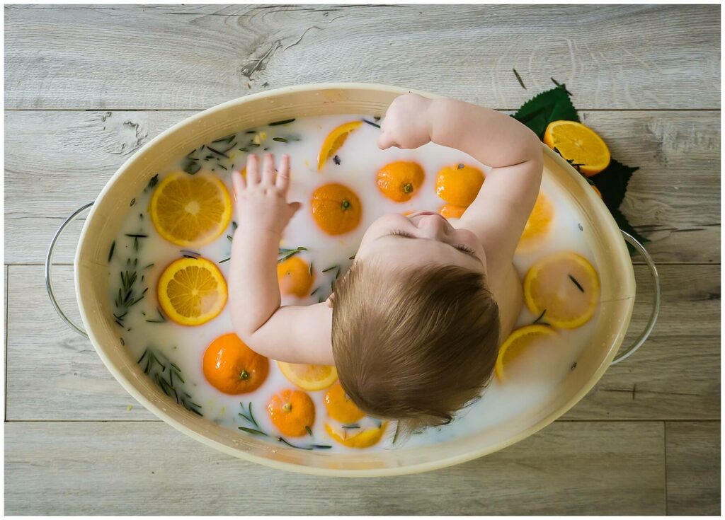 baby in orange milk bath