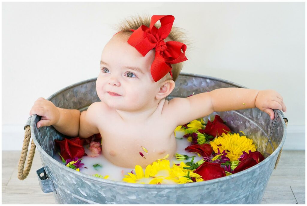 baby in flower milk bath