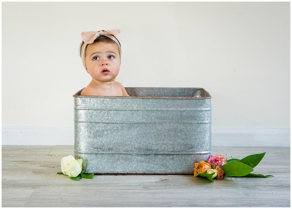 baby in rose milk bath