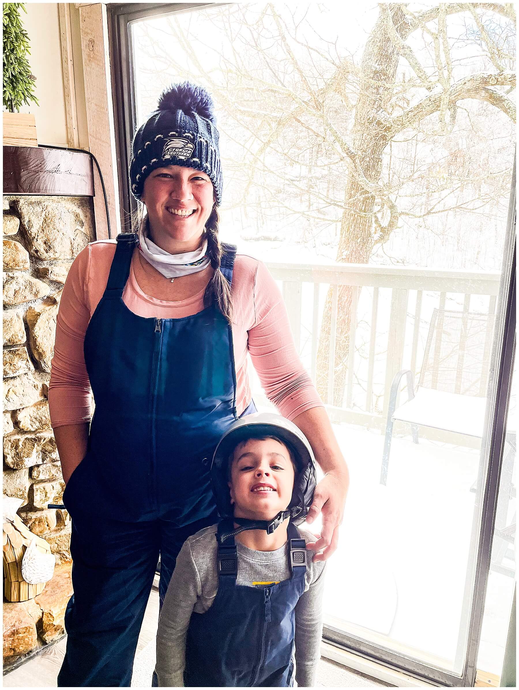 mom and son dressed for snow skiing