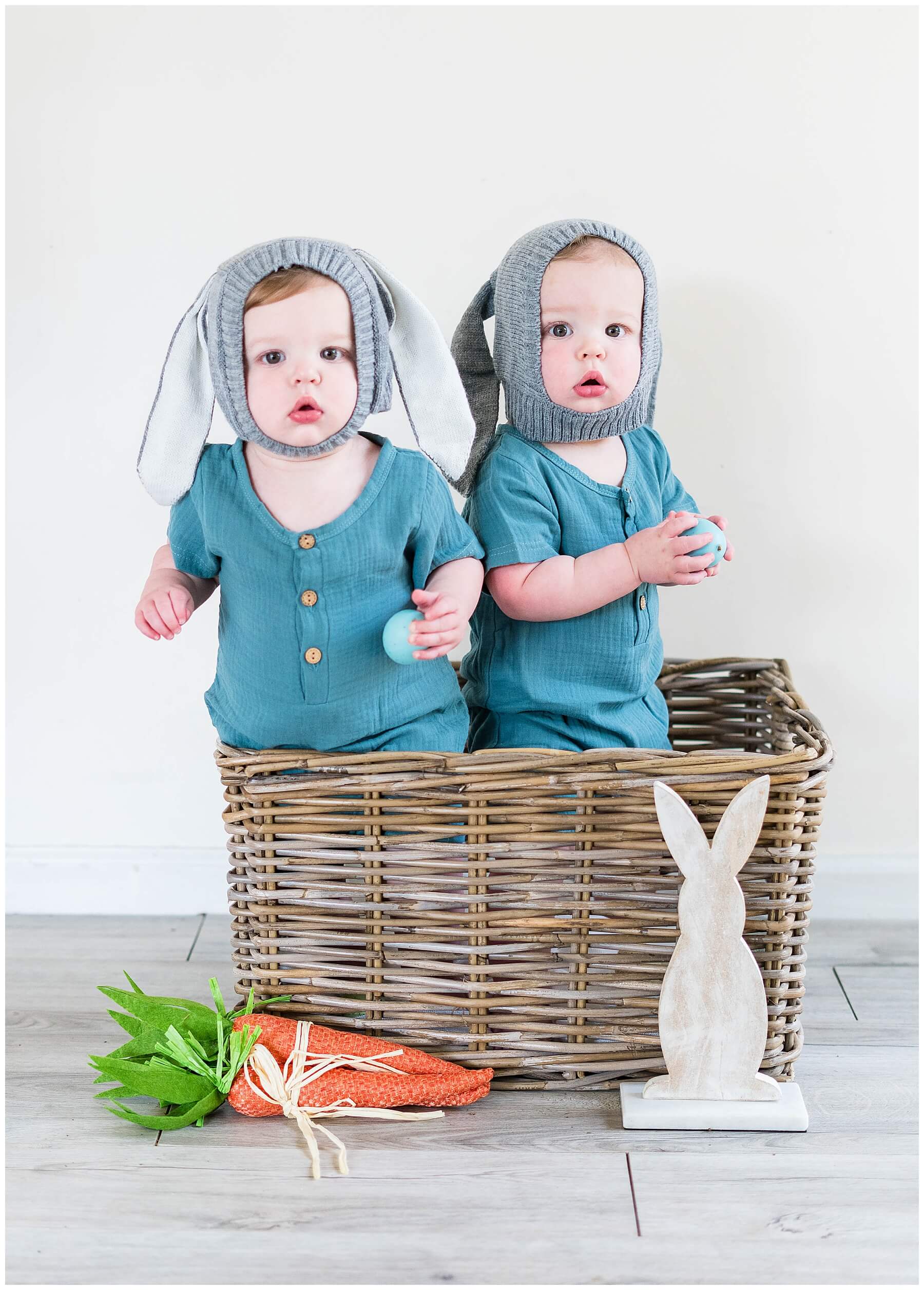 baby boy twins in basket with easter decor