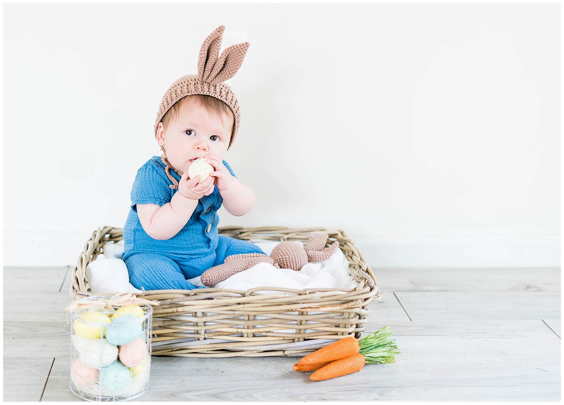 baby boy in basket with easter decor