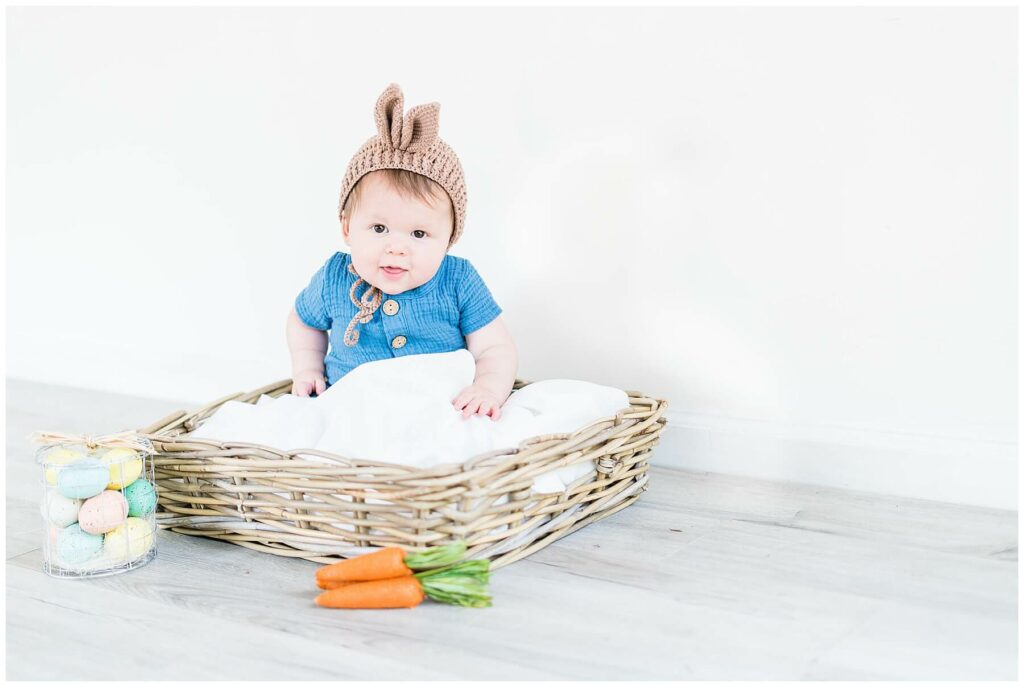 baby boy in a basket with easter decor