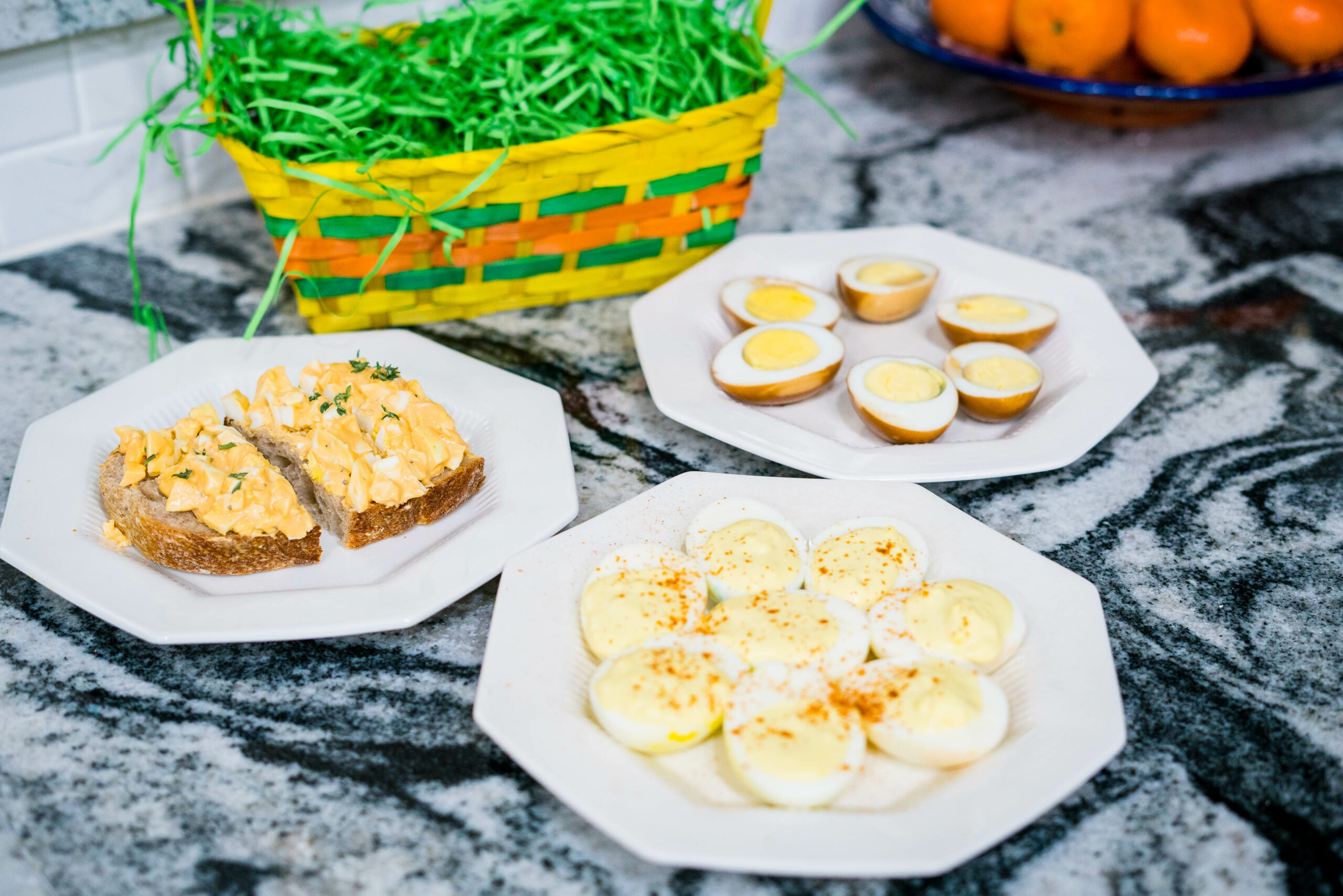 boiled eggs prepared 3 ways - deviled, egg salad, and soy sauce eggs