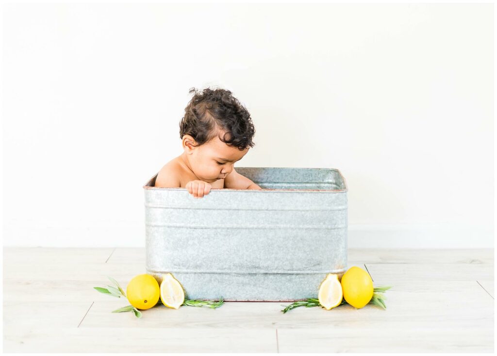 little boy in a lemon milk bath
