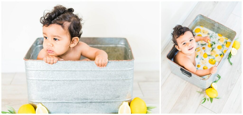 baby boy sitting in milk bath of lemons and herbs