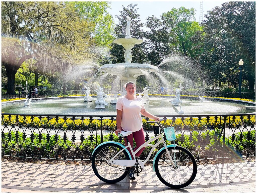 lady with bike in front of Forsyth Park Fountain Savannah Georgia