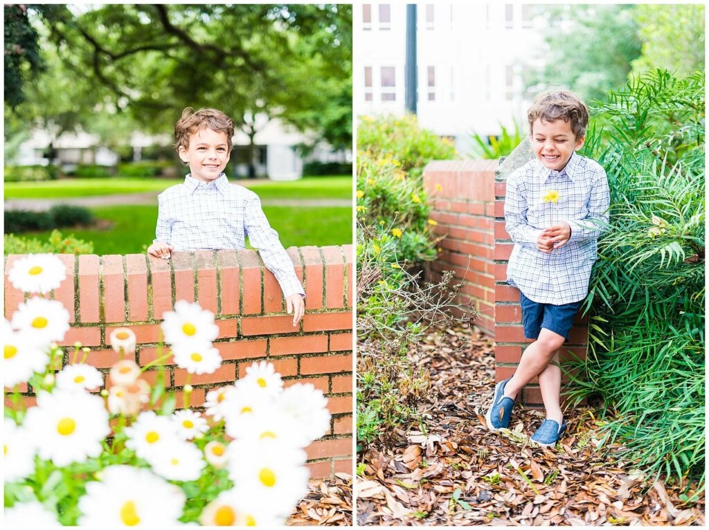 little boy posing with brick wall and flowers in downtown savannah Telfair square