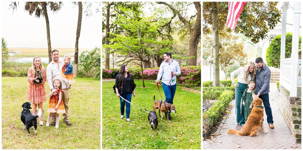 This image is a collage of three family portraits, each taken outdoors with pets included, capturing warm, candid moments. First (far left): A family of four poses on a grassy lawn with a backdrop of palm trees and marshland. The mother is holding a cat, while the father holds their toddler, and their older daughter stands in front smiling. A black dog faces the family in the foreground. The family is dressed in earthy, coordinated tones — the children wear matching orange-and-red tiered dresses with boots, and the mother wears a floral dress. The overall vibe is rustic and cheerful. Second (middle): A couple walks side by side in a park surrounded by green trees and blooming azalea bushes. Both are casually dressed in jeans; the woman wears a black blouse, and the man wears a light blue button-up shirt. Each is holding a leash, walking their two dogs. They’re smiling at each other, giving the image a relaxed, natural feel. Third (far right): A family of three stands in front of a porch beneath an American flag. The father kneels slightly while petting their golden-colored dog, as their young daughter in a green patterned dress leans toward him laughing. The mother, dressed in green pants and a light sweater, looks on smiling. The brick pathway, greenery, and porch setting create a cozy, welcoming family atmosphere. Overall, this collage emphasizes family bonds and the inclusion of beloved pets, blending natural backdrops with genuine, joyful interactions.