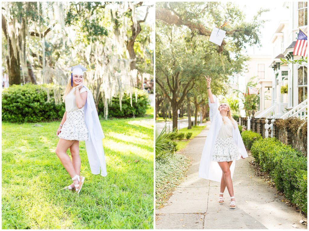 high school senior wearing a white cap and gown posing for photos in downtown savannah 