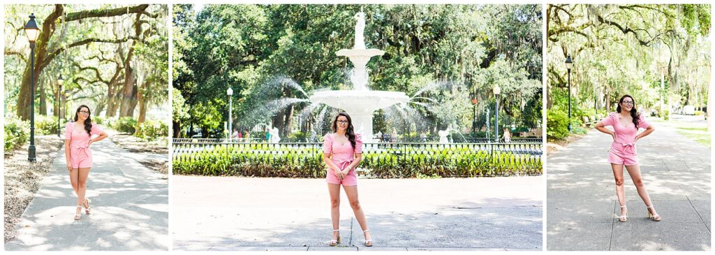 high school senior wearing a pink romper standing in Savannah's Forsyth Park