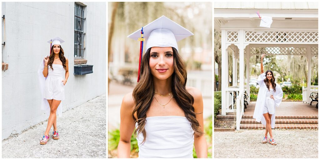 high school senior girl wearing a white romper and a cap & gown standing in downtown Savannah's Crawford square 