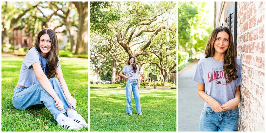 This image is a collage of three photos featuring a high school senior during a casual outdoor photo session in a beautiful, sunny setting—in Savannah, Georgia. Left Photo: The girl is sitting on the grass in a lush, green park. She has long brunette hair, is smiling brightly, and is wearing a gray crop top with “Carolina Gamecocks” on it, paired with loose-fitting blue jeans and white Adidas sneakers. Large, mossy oak trees and charming historic buildings are visible in the background, giving the image a very classic Southern feel. Center Photo: The girl is standing confidently in the middle of the same park, surrounded by tall live oak trees with hanging Spanish moss. She has one hand on her hip and a big smile on her face. Her casual outfit and the natural setting create a relaxed, joyful vibe. Right Photo: She is leaning casually against a red brick wall, still smiling warmly. The lighting is soft and natural, and the background is a quiet, tree-lined pathway—another nod to Savannah’s historic charm.