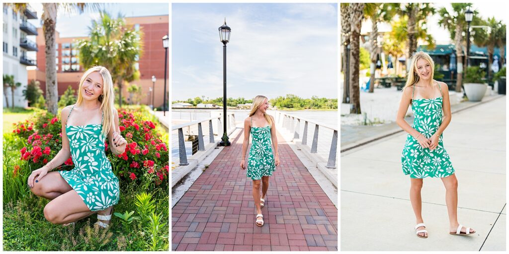 This image collage showcases a high school senior in three different outdoor locations around Savannah, all highlighting a fresh, playful, and sunny vibe. She is wearing a green mini dress with bold white floral patterns and thin straps, paired with simple white sandals. Her straight blonde hair and natural makeup give her a soft, cheerful look that complements the bright environment. Left Image: She’s kneeling among vibrant red flowers and tropical greenery, smiling sweetly at the camera. Palm trees and modern buildings in the background give it that signature Savannah blend of charm and contemporary style. Middle Image: She’s walking along a brick-paved pier or walkway by the river, smiling off to the side. A tall lamppost frames the scene, and the sky is wide and clear, giving this shot an airy, carefree feel. Right Image: She stands on a palm-lined sidewalk in a casual pose, slightly leaning with a relaxed smile. The background features beachy elements and a coastal-town aesthetic—evoking fun, summer, and a little bit of adventure. Altogether, the set captures her youthful energy and joy, mixing tropical elements with classic Southern charm—perfectly aligned with the spirit of senior portraits in Savannah.