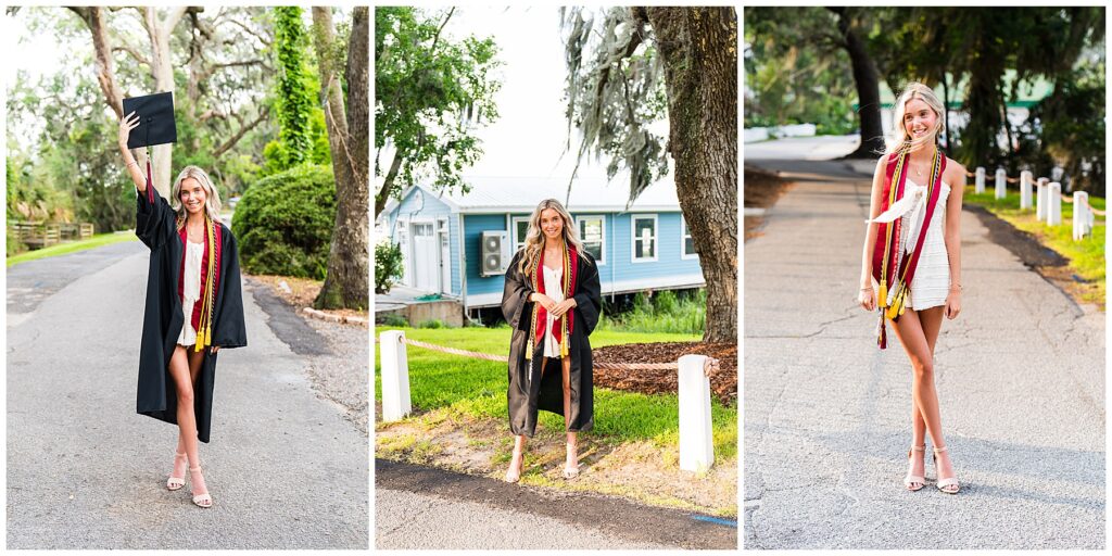 This image collage features three senior graduation portraits, each showcasing a mix of celebration, pride, and personal style:

Left Image:
The senior stands confidently in the middle of a tree-lined road, holding her black graduation cap high above her head in celebration. She wears a black graduation gown open at the front, revealing a white romper and layered honor cords in maroon, gold, and red. Her soft pink heels add an elegant touch to the festive moment.
Center Image:
In this full-body shot, she’s standing in front of a light blue building with white trim, likely a waterfront structure. The gown flows naturally around her as she gently holds the lapels and smiles. Her long blonde hair and honor cords drape over the front of the robe, giving a polished, well-earned graduate look.
Right Image:
With her cap off and gown removed, the senior poses on a quiet road wearing just her white romper and stacked cords. Her hands are relaxed by her sides, and she’s smiling with a slight breeze in her hair. The setting sun adds warmth, casting golden light along the path behind her.
Each image captures a different facet of graduation day—from joyful announcement to quiet reflection—and emphasizes both her academic achievements and personal style.