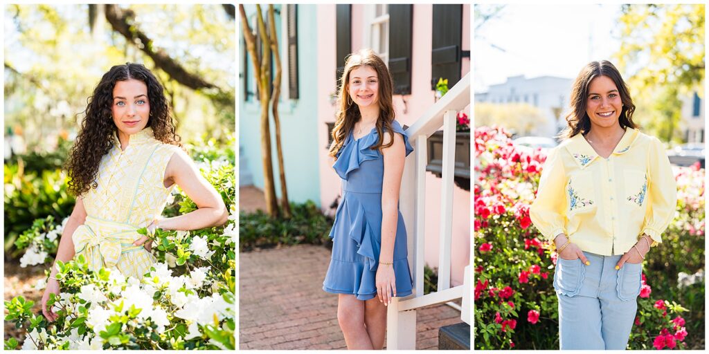 This is a three-panel portrait collage featuring girls/young women in colorful spring-inspired outfits, photographed outdoors in bright natural light with flowers and charming architecture as backdrops. The overall feel is vibrant, feminine, and cheerful, with a soft Southern garden aesthetic. Left photo: A young woman with long dark curly hair and bright blue eyes stands among blooming white flowers beneath large trees. She is wearing a sleeveless pale yellow-and-white patterned dress with a high neckline and waist tie. One hand rests on her hip while the other lightly touches the flowers, creating a poised, editorial feel. The sunlight filtering through the trees gives the image a warm, glowing quality. Middle photo: A younger girl with long brown hair stands beside the steps of a charming pastel-colored home. She is wearing a dusty blue ruffled dress with layered details and a softly flared skirt. The setting includes soft pink and mint architectural accents, black shutters, and a brick walkway, giving the image a classic Savannah neighborhood charm. She smiles naturally at the camera while leaning casually against the stair railing. Right photo: A brunette young woman smiles brightly in front of a vibrant hedge of bright pink flowers. She wears a light yellow blouse with embroidered floral details paired with light blue pants featuring scalloped pocket trim. With her hands tucked casually into her pockets, the pose feels confident yet relaxed. The bright florals and sunlight make the image feel playful and energetic. Overall, the collage has a fresh spring/summer color palette — soft yellows, blues, whites, and pinks — and feels very garden-inspired and polished. The combination of florals, pastel architecture, and natural light gives it a distinctly Savannah, Southern portrait aesthetic that feels bright, joyful, and timeless.
