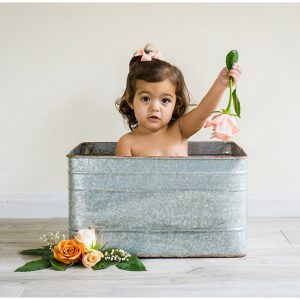 baby in rose milk bath